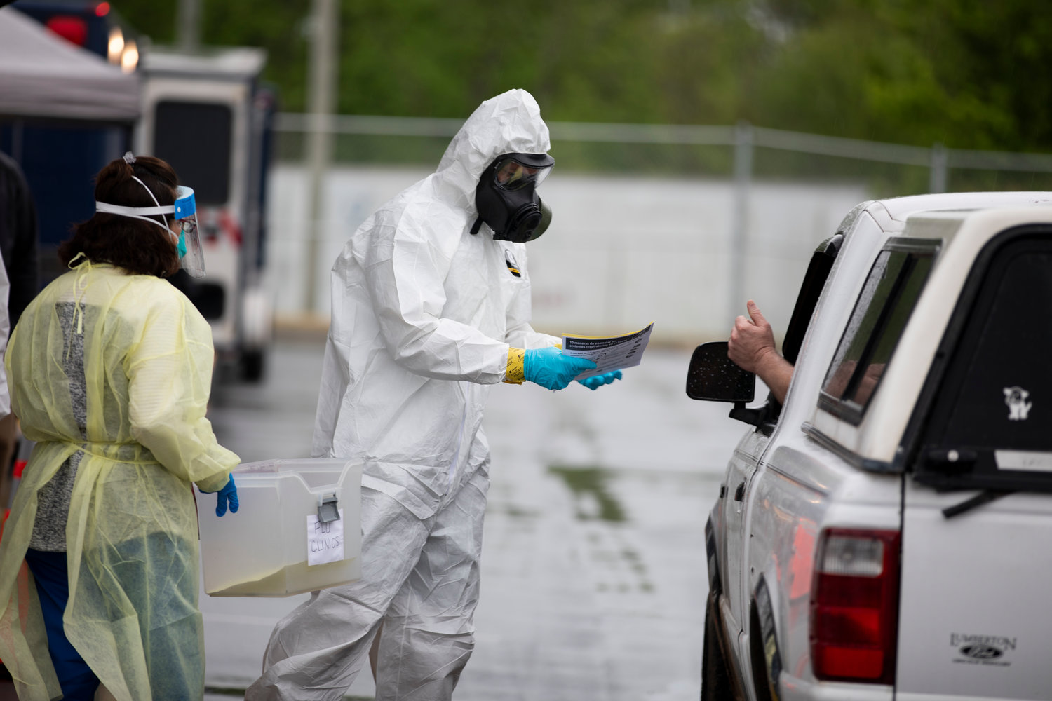 A North Carolina National Guard Soldier with the 42nd Civil Support Team works with local health and emergency officials to conduct drive-thru and walk-up COVID-19 testing for employees of the Mountaire Farms poultry processing plant in Siler City on April 23, 2020.